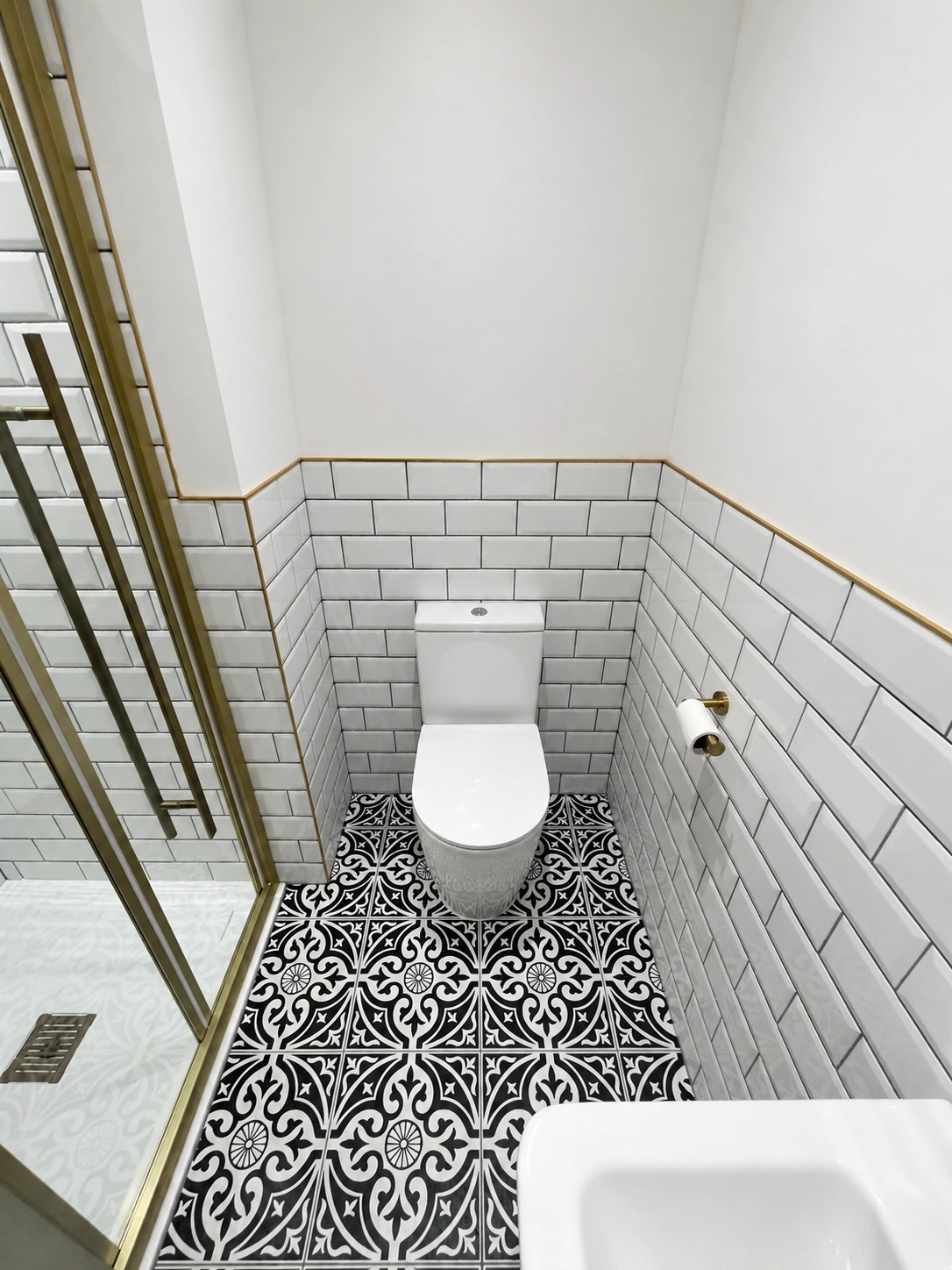 Completed black and brass bathroom installation in Leeds