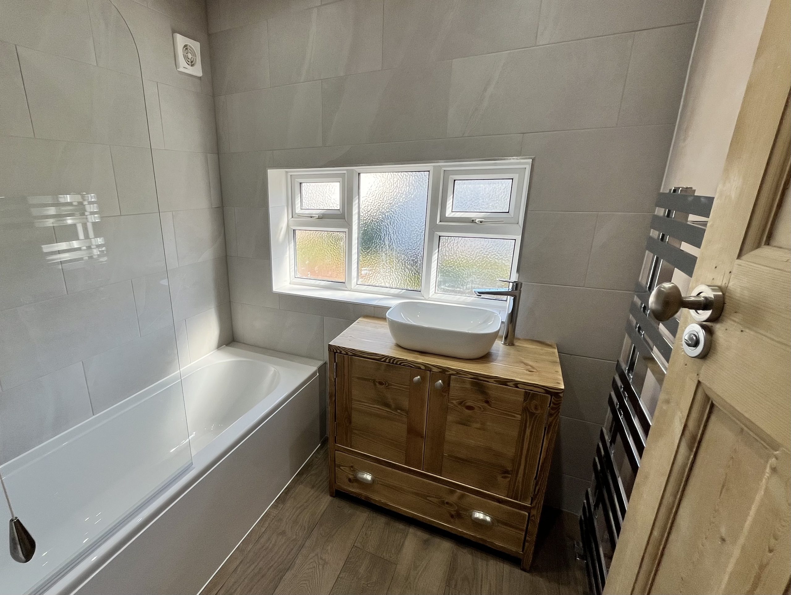 Completed grey and timber bathroom installation in Leeds